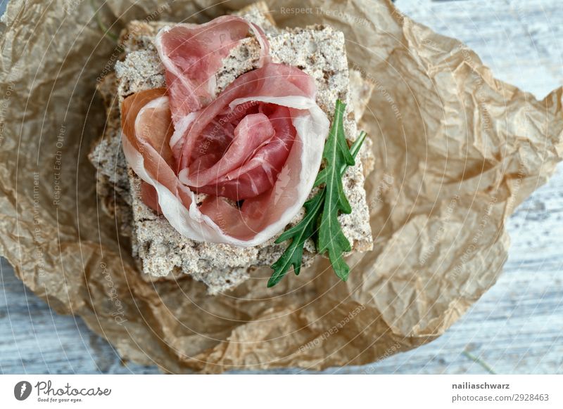 Crispbread with ham Food Grain Dough Baked goods Herbs and spices Rucola Ham Strips of ham Nutrition Organic produce Italian Food Lifestyle Paper baking paper