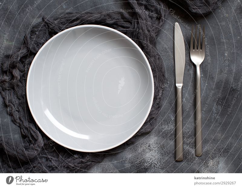 Grey plate on a dark background Plate Modern Above Gray Black dark and moody Monochrome plating Conceptual design Minimal Deserted Copy Space middle