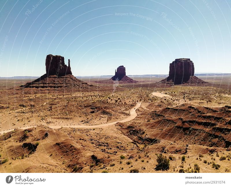 Monument Valley Environment Nature Landscape Elements Earth Sand Sky Cloudless sky Summer Beautiful weather Warmth Drought Bushes Rock Mountain Peak Canyon Blue