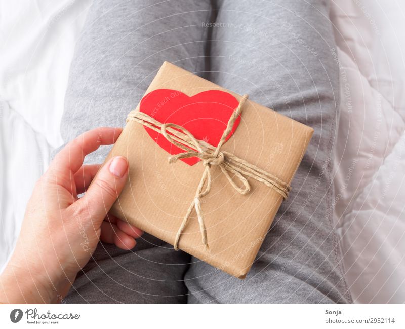 Woman with gift package with heart Mother's Day Birthday Feminine Adults Life Hand 1 Human being 45 - 60 years Packaging Package Heart Touch Anticipation