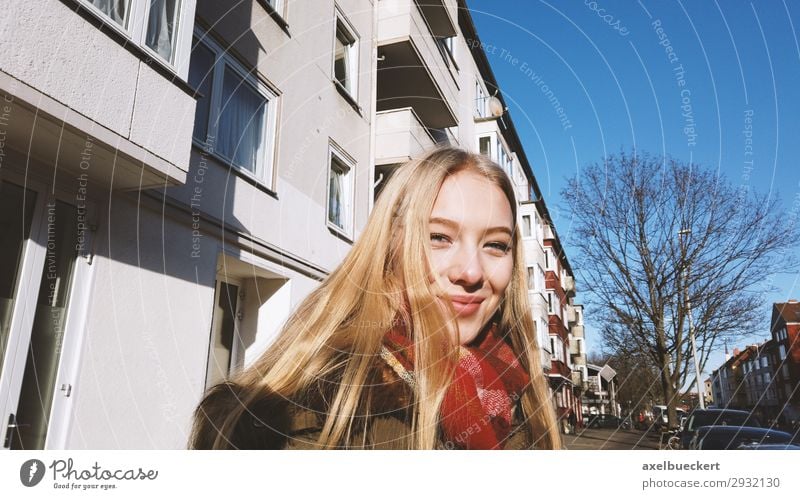 cheerful young woman on the street in winter Lifestyle Young woman Winter Youth (Young adults) Authentic Smiling City life Leisure and hobbies Human being