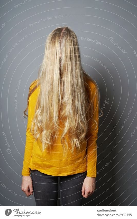 female teenager hiding behind long blond hair Human being Feminine Girl Young woman Youth (Young adults) Woman Adults 1 13 - 18 years 18 - 30 years