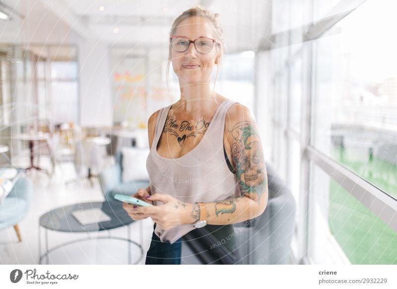 tattooed busy business woman writing notes in meeting room - a Royalty Free  Stock Photo from Photocase