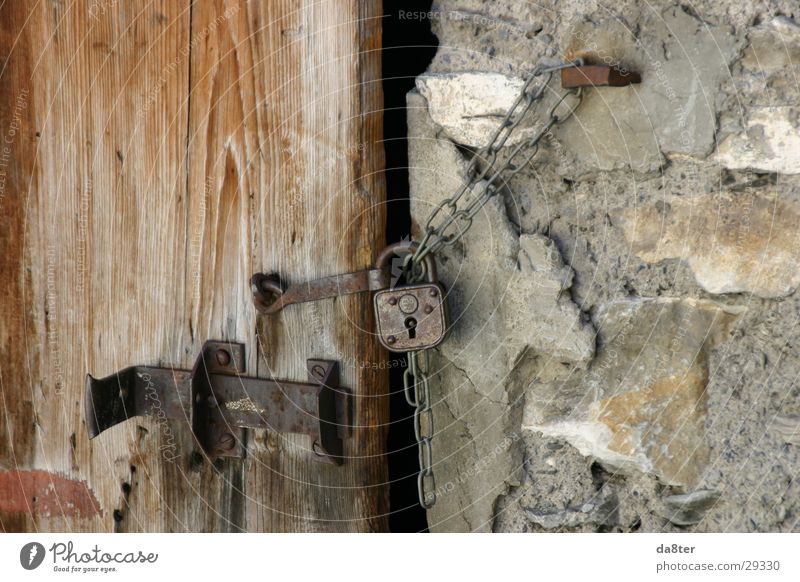 Old door lock Door lock Locking bar Padlock Wall (barrier) Wall (building) Wooden door Stone wall Castle Chain