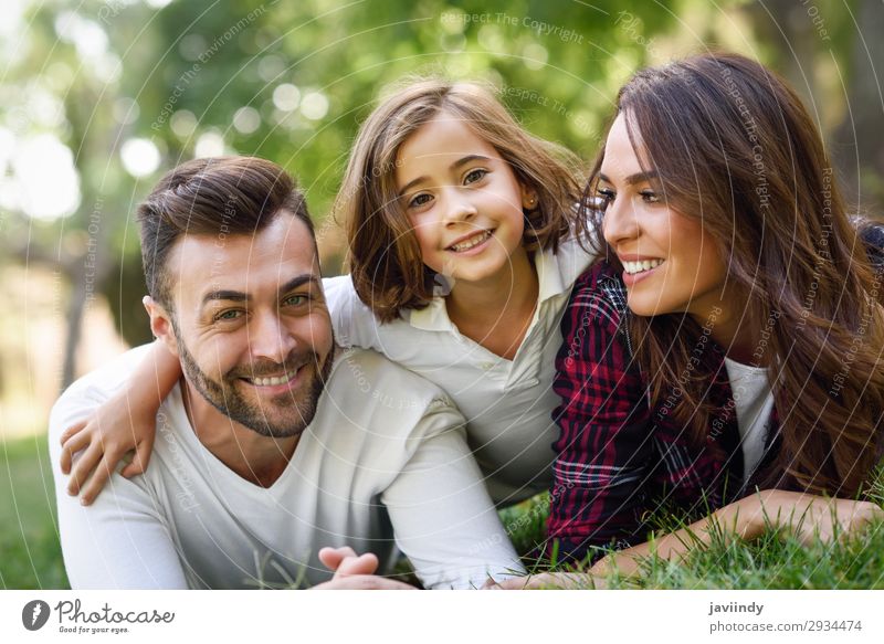 Happy young family in a urban park Lifestyle Joy Beautiful Summer Child Human being Girl Young woman Youth (Young adults) Young man Woman Adults Man Parents