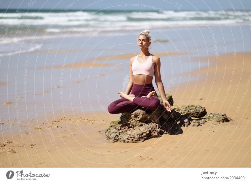 Caucasian blonde woman practicing yoga in the beach Lifestyle Beautiful Body Harmonious Relaxation Calm Meditation Summer Beach Ocean Sports Yoga Human being