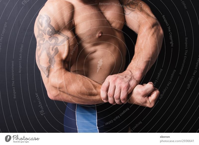 hand a powerful bodybuilder with a tattoo Lifestyle Healthy Leisure and hobbies Night life Entertainment Party Event Sports Fitness Sports Training Sportsperson