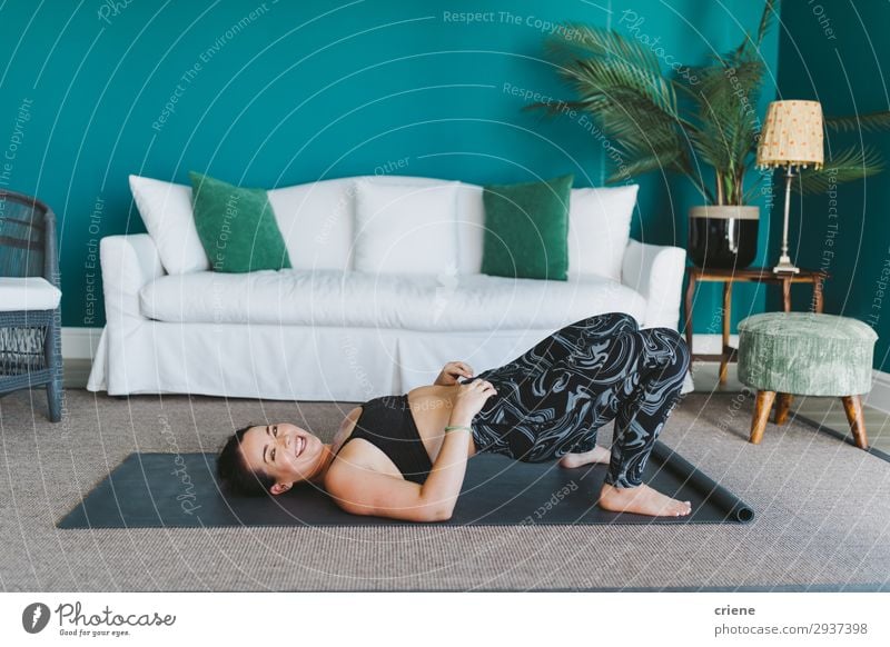 happy young female practicing yoga on fitness mat at home Lifestyle Joy Happy Beautiful Body Face Living room Sports Yoga Human being Woman Adults Plant Fitness