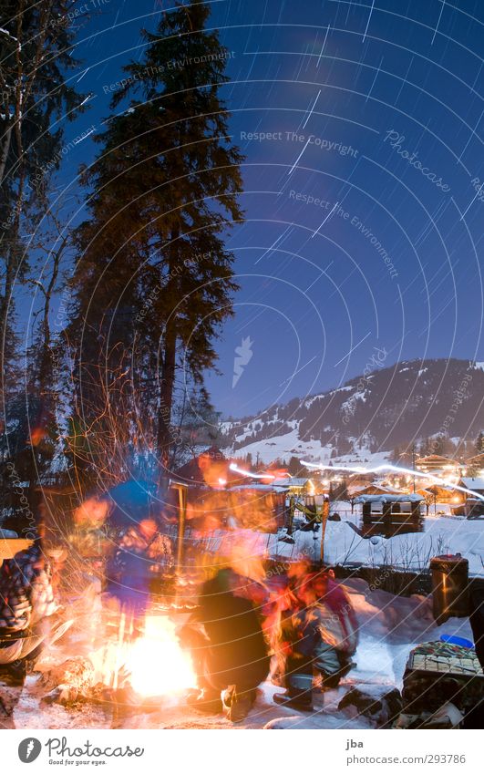 warming fire Life Trip Winter Snow Mountain Night life Feasts & Celebrations Human being Group Nature Fire Air Night sky Stars Beautiful weather Saanenland