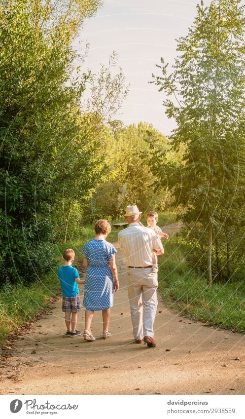 Grandparents and grandchildren walking outdoors Lifestyle Leisure and hobbies Summer Child Human being Baby Boy (child) Woman Adults Man Grandfather Grandmother