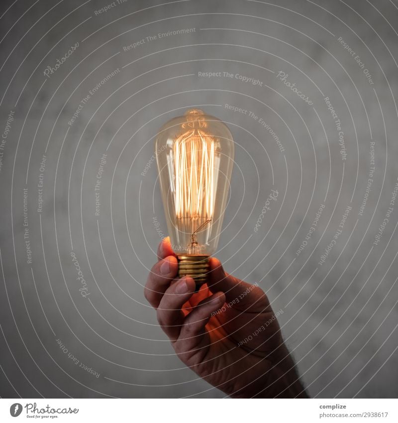 Good idea | Glowing vintage light bulb in hand Lifestyle Living or residing Flat (apartment) House building Redecorate Moving (to change residence)