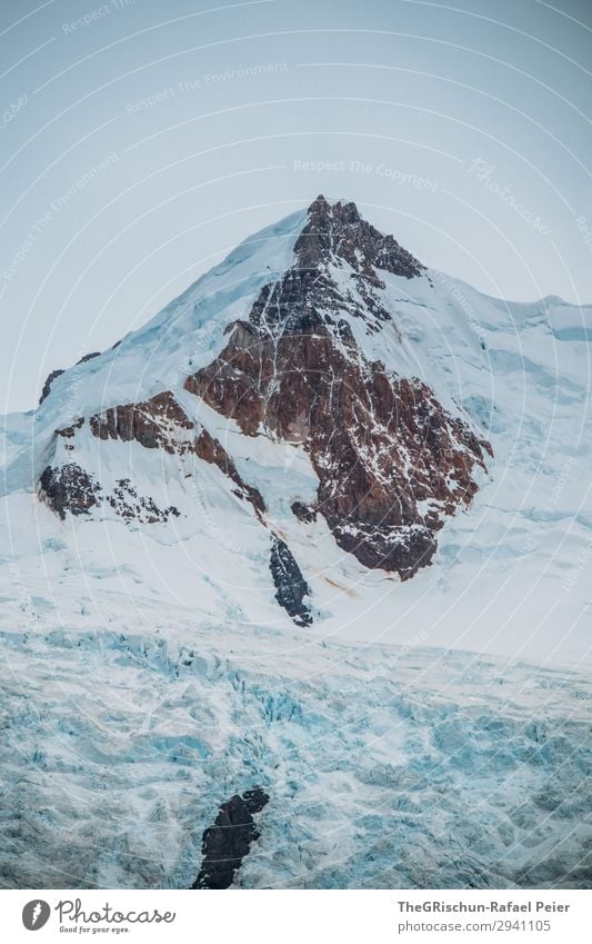 Glacier Mountain Nature Blue Brown Black White Wall of rock Snow Clouds Melt Calving Argentina Patagonia Colour photo Exterior shot Deserted Copy Space bottom