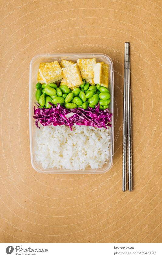 Healthy asian-style vegan bento box Red cabbage Tasty Green Cooking metal chopsticks take away lunch box zero waste Healthy Eating Frying edamame Tofu