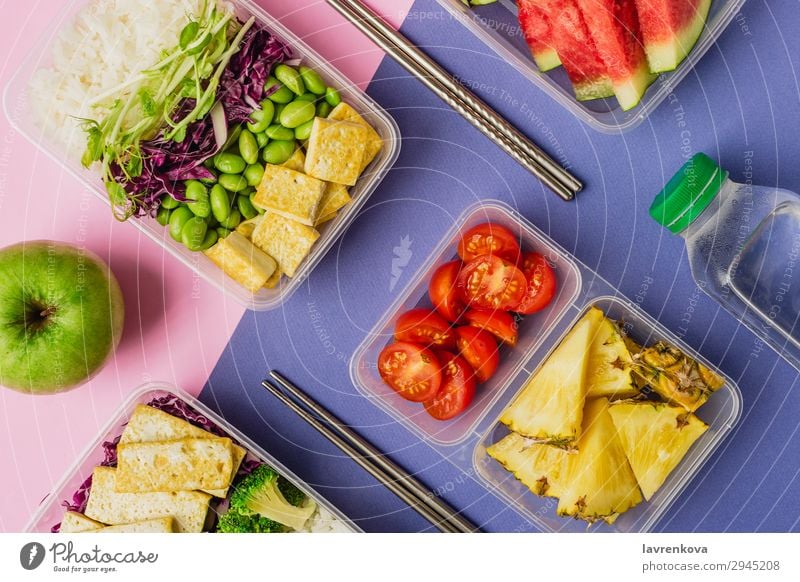 Two healthy asian-style plant-based lunch boxes knolling Apple flatlay Asian Food Asian rice dish bento Broccoli Tomato Container Delicious Diet Dinner Dish