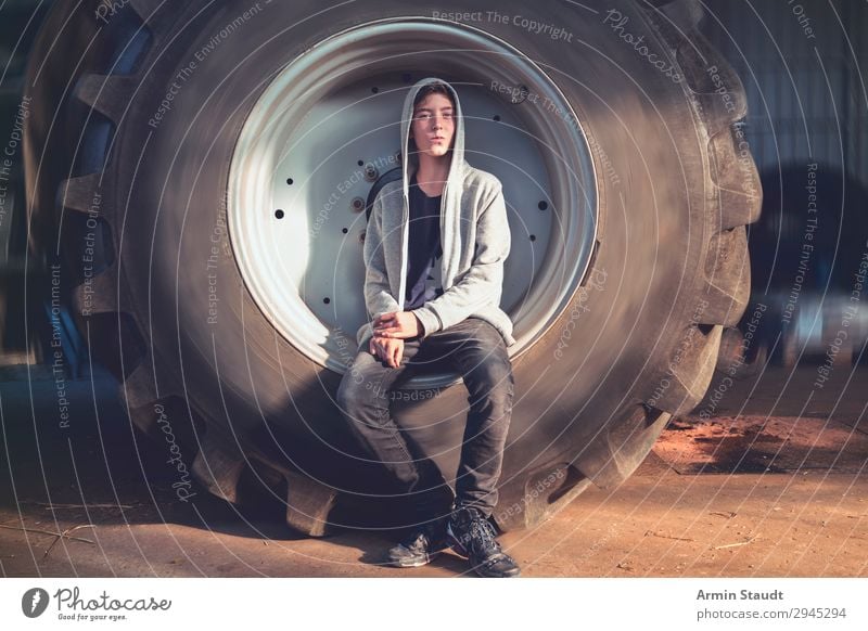 Portrait in tractor tyre II Lifestyle Style Beautiful Well-being Senses Relaxation Adventure Work and employment Workplace Human being Masculine Young man