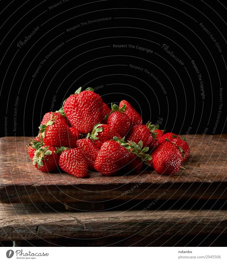 bunch of fresh ripe red strawberries Fruit Dessert Table Nature Leaf Wood Dark Fresh Small Delicious Natural Juicy Red Black Strawberry sweet Berries bush food