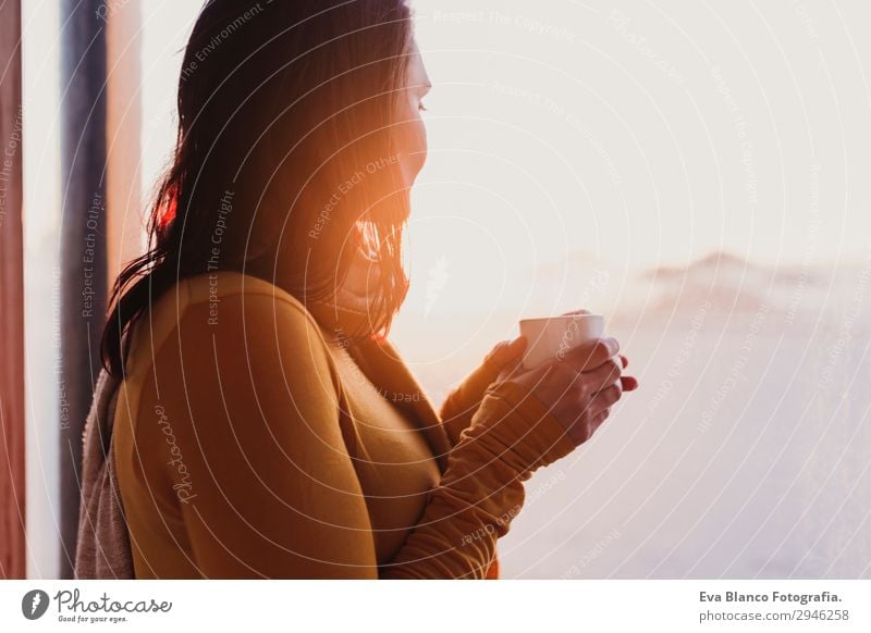 woman enjoys fresh coffee at sunset at the beach Breakfast Beverage Coffee Espresso Tea Lifestyle Happy Beautiful Relaxation Leisure and hobbies Beach