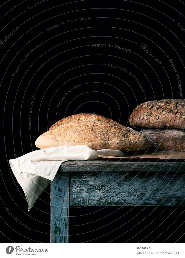 baked loaves of bread on a wooden table Bread Nutrition Eating Breakfast Diet Table Wood Dark Fresh Delicious Natural Brown Black White Tradition Baking Bakery