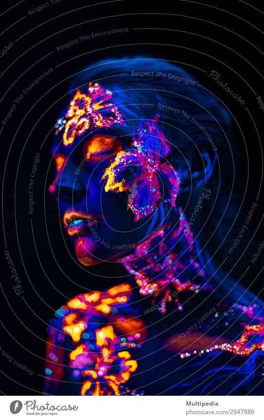 Beautiful flowers in UV light on a young girl face and body Style Body Face Make-up Woman Adults Art Elements Earth Water Flower Love Fantastic Uniqueness Blue