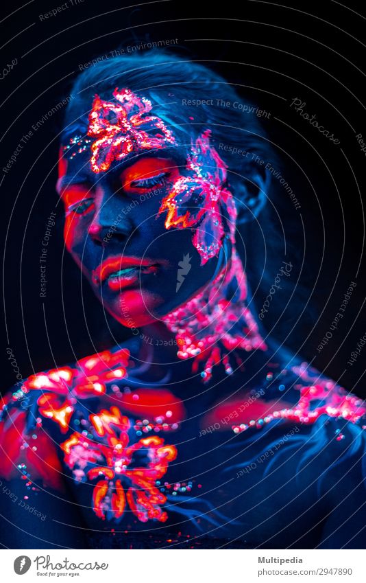 Beautiful flowers in UV light on a young girl face and body Style Body Face Make-up Woman Adults Art Elements Earth Water Flower Love Fantastic Uniqueness Blue