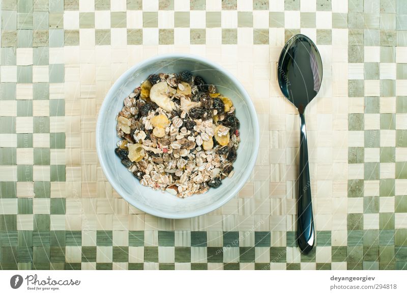 Muesli breakfast in a bowl and spoon Dessert Nutrition Breakfast Vegetarian diet Diet Bowl Spoon Table Energy Cereal grain Meal milk Banana Snack Horizontal