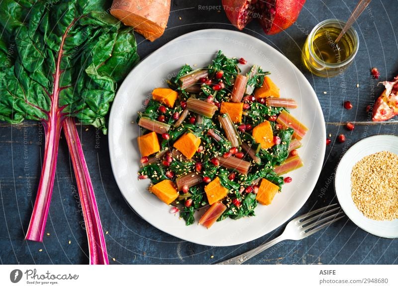 Swiss chard with sweet potato and pomegranate Vegetable Fruit Nutrition Eating Dinner Vegetarian diet Diet Plate Fork Leaf Fresh Delicious Blue Green Red