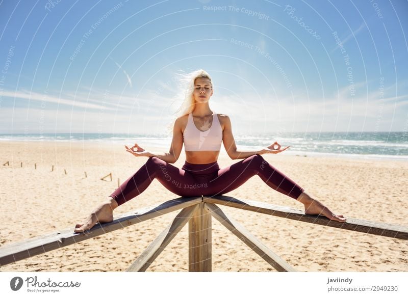 Caucasian blonde woman practicing yoga in the beach Lifestyle Beautiful Body Relaxation Meditation Summer Beach Ocean Sports Yoga Work and employment