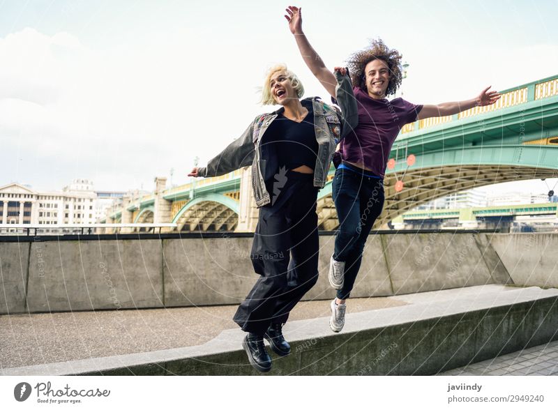 Funny couple jumping near River Thames, London Joy Happy Beautiful Vacation & Travel Human being Masculine Feminine Young woman Youth (Young adults) Young man