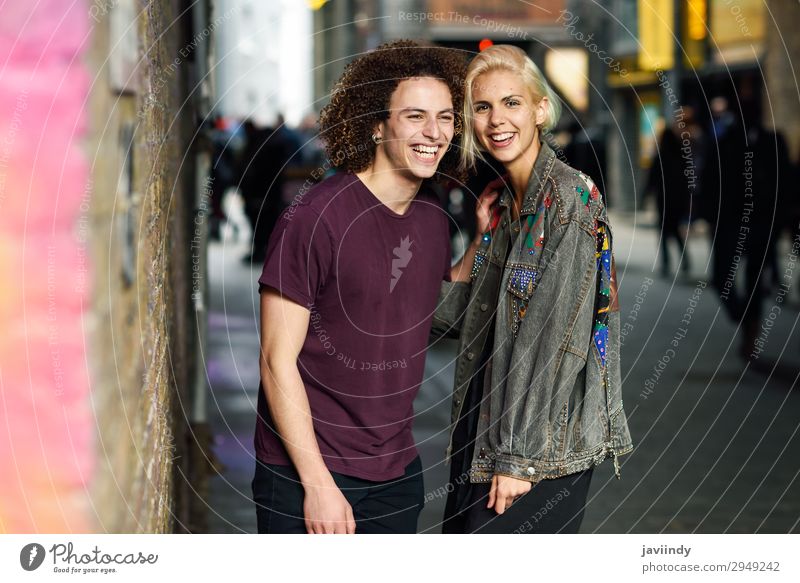 Young couple talking in urban background Lifestyle Joy Happy Beautiful Hair and hairstyles To talk Human being Masculine Feminine Young woman
