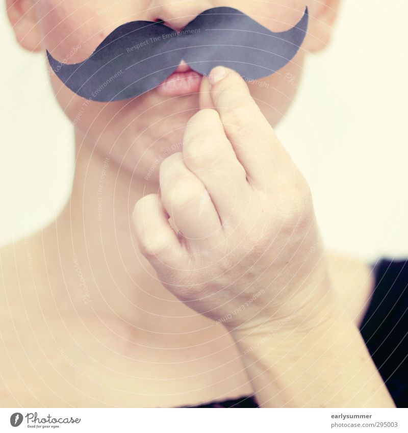 young woman holds mustache in front of her face Lifestyle Face Party Going out Funny Nerdy Joy Surrealism Facial hair Moustache Moustache hair moustache Mouth
