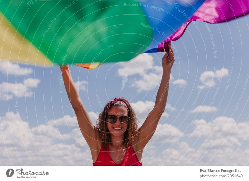 Woman holding the Gay Rainbow Flag over blue sky outdoors Lifestyle Joy Happy Leisure and hobbies Freedom Summer Sun Wedding Human being Feminine Homosexual