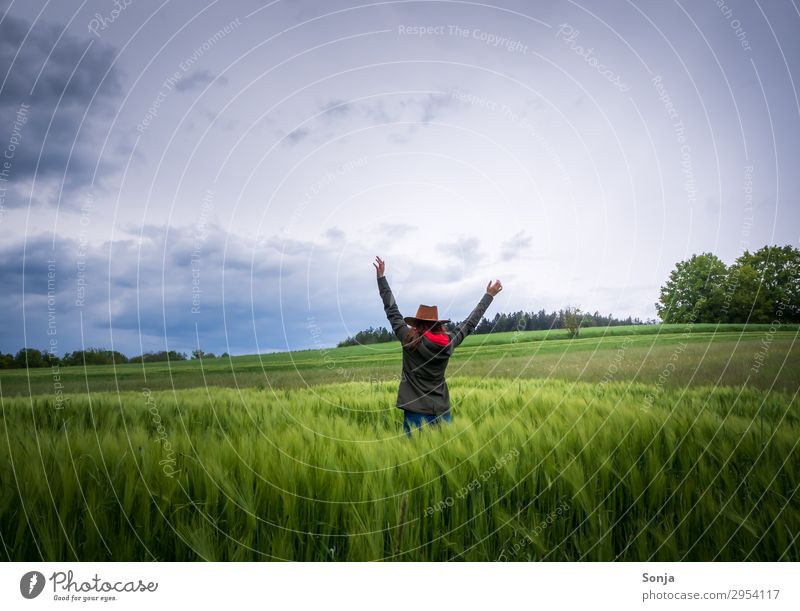 Young woman with raised hands in the cornfield Lifestyle Vacation & Travel Freedom Hiking Feminine Youth (Young adults) 1 Human being 18 - 30 years Adults