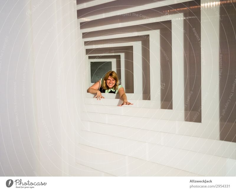 Portrait of a young woman in several frames 1 Person Young woman Portrait photograph Central perspective Frame Tunnel Interior shot Studio shot Illusion Joy