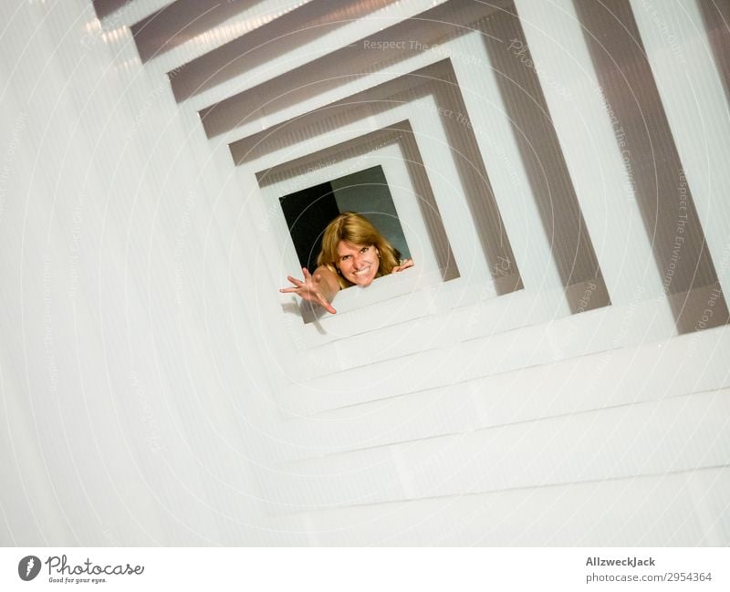 Portrait of a young woman in several frames 1 Person Young woman Portrait photograph Central perspective Frame Tunnel Hollow Interior shot Studio shot Illusion