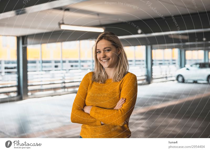 cheerful young woman in parking garage Lifestyle Joy Happy pretty Contentment Relaxation Leisure and hobbies Summer University & College student Young woman