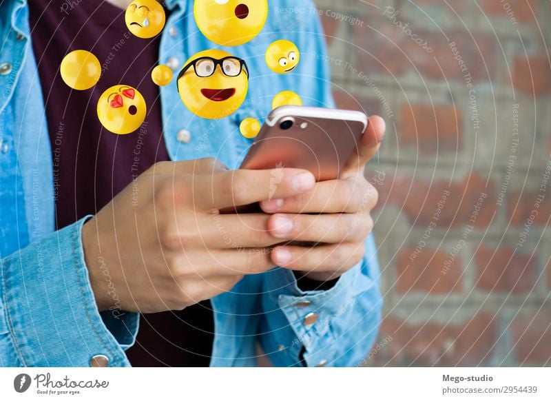 Man using smartphone sending emojis Lifestyle Happy Face Telephone PDA Screen Technology Internet Human being Adults Hand Funny Modern Smart Emotions young