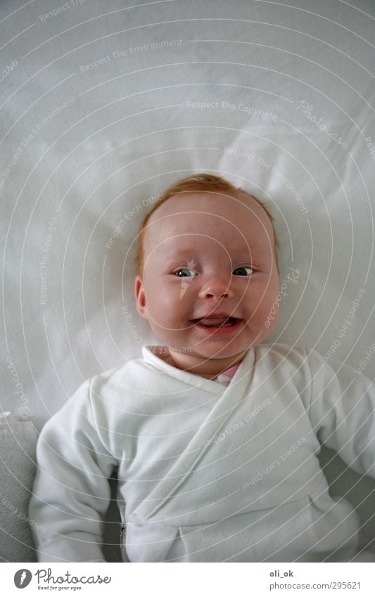 Baby mimic Head Chest 1 Human being 0 - 12 months Smiling Laughter Friendliness Happiness White Joy Colour photo Detail Copy Space top Bird's-eye view Forward