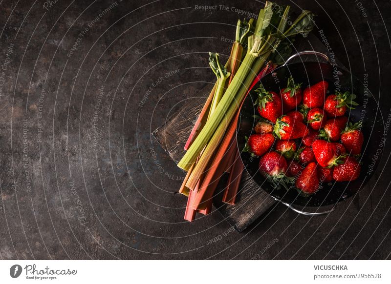 Rhubarb and strawberries on a rustic kitchen table Food Fruit Nutrition Organic produce Vegetarian diet Diet Shopping Style Design Healthy Eating Summer Table