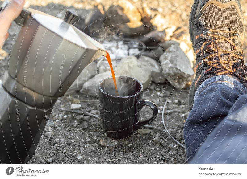 Preparing coffee in bonfire during a camp in nature. Breakfast Organic produce Hot drink Coffee Pot Cup Lifestyle Wellness Harmonious Contentment Relaxation
