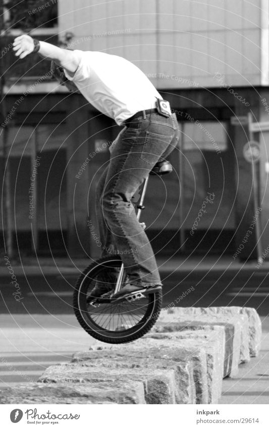 unicycle Ride a unicycle Jump Contentment Hop Man Stone Jeans Bicycle