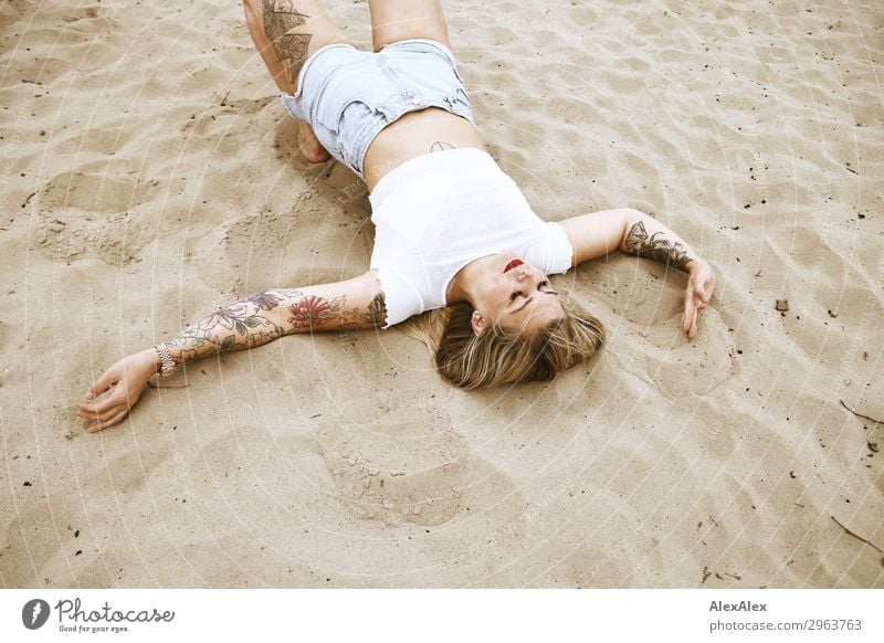 Tattooed woman on the beach upside down Lifestyle Style Joy Beautiful Well-being Adventure Young woman Youth (Young adults) 18 - 30 years Adults Sand Spring