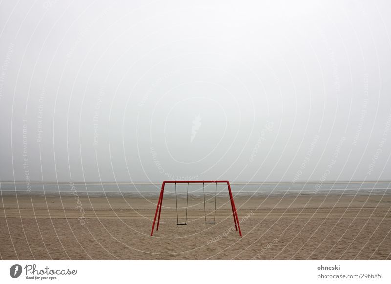 playground Playground Swing Sand Bad weather Coast Beach North Sea Langeoog Deserted Loneliness Fear Apocalyptic sentiment Far-off places Colour photo