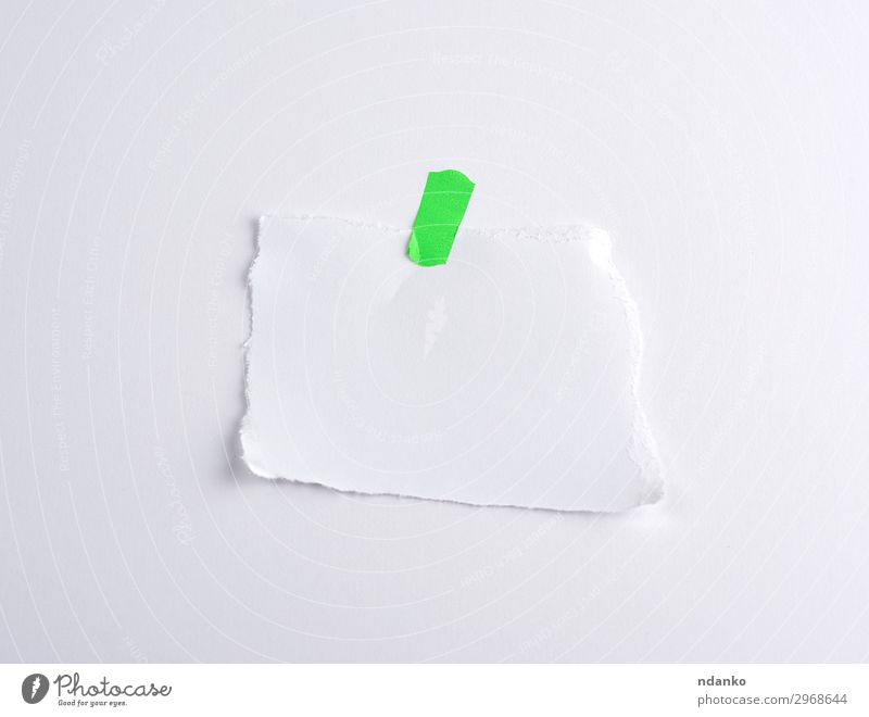 torn off white piece of paper glued to green velcro Office Paper Collection Above Green White Information part element background Banner Blank communication