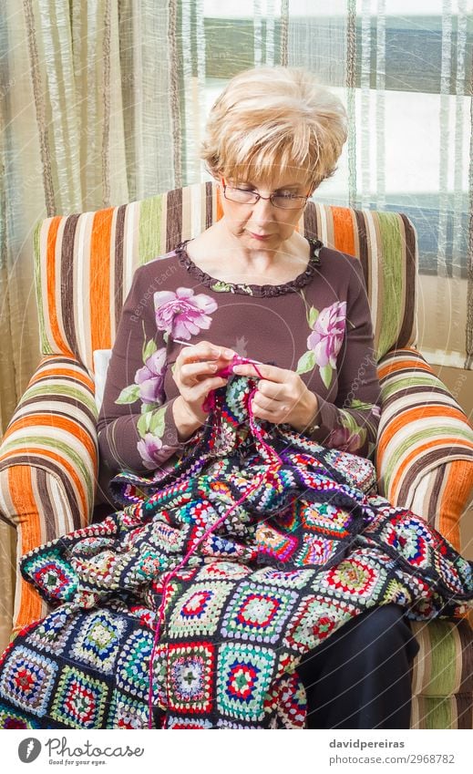 Portrait of woman knitting a vintage wool quilt Relaxation Leisure and hobbies Knit Work and employment Craft (trade) Human being Woman Adults Mother