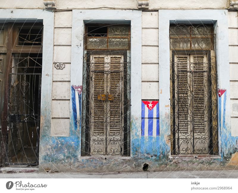 Cuban flags Deserted House (Residential Structure) Facade Window Door Grating Flag Old Authentic Dirty Closed Wooden door Wooden window Painted Weathered