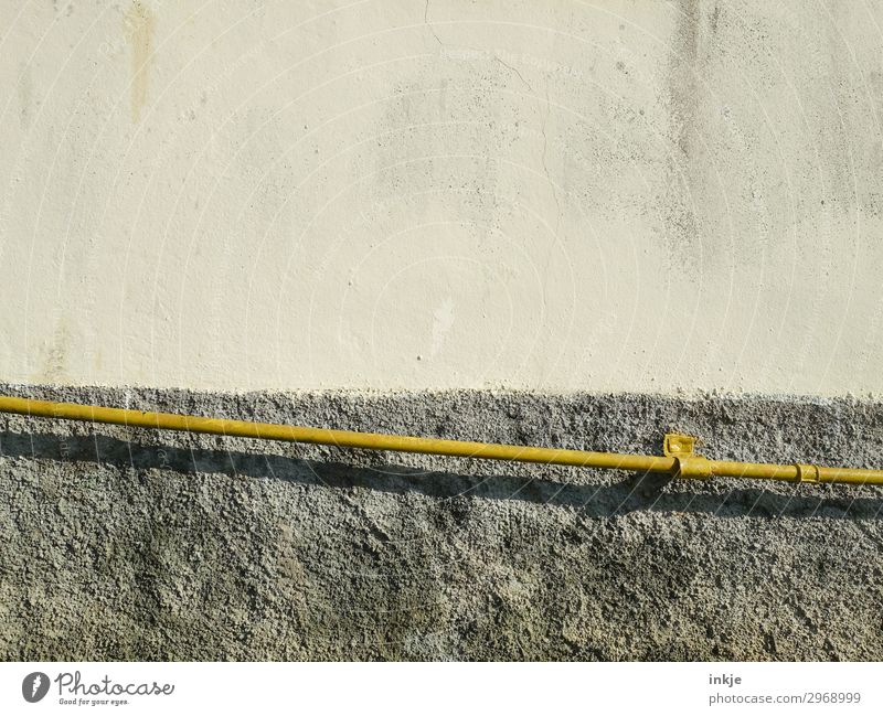 yellow tube Deserted Wall (barrier) Wall (building) Facade Pipe Conduit Line Stripe Thin Long Yellow Tilt Colour photo Subdued colour Exterior shot Close-up