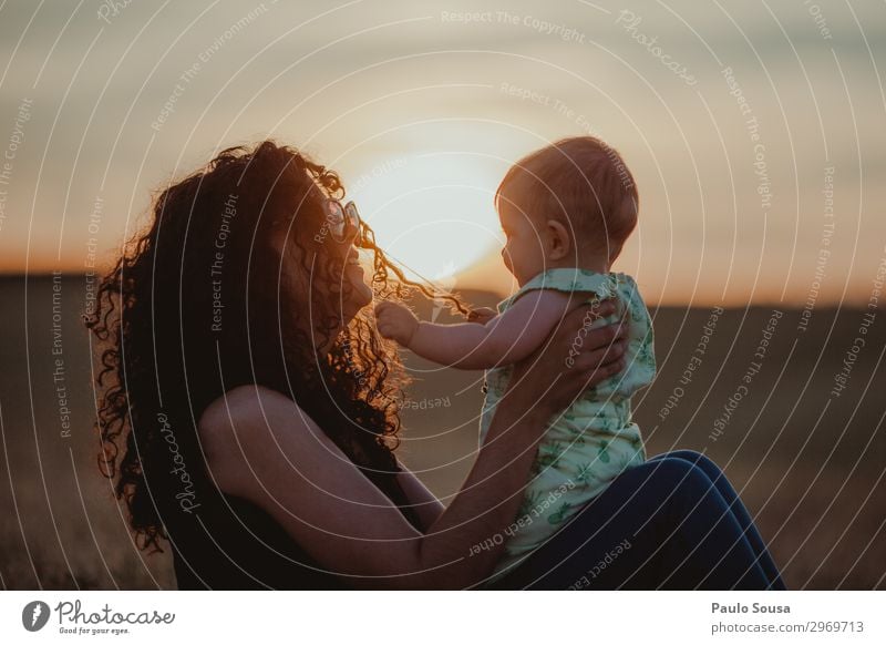 Mother and Daughter at sunset Lifestyle Human being Feminine Child Baby Toddler Girl Adults 2 0 - 12 months 18 - 30 years Youth (Young adults) Curl Touch Love