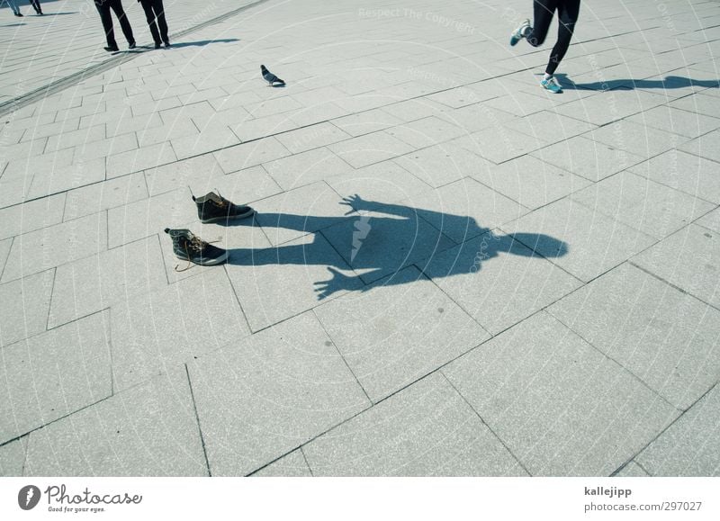 a shadow of itself Human being Masculine Body 1 Stand Places Jogger Pedestrian Anonymous Sidewalk Footwear Expressionless Colour photo Exterior shot Light