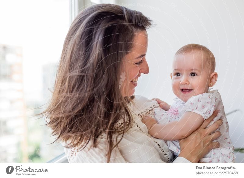 portrait of a beautiful baby girl and her mother at home Lifestyle Joy Happy Beautiful Playing Flat (apartment) House (Residential Structure) Room Living room