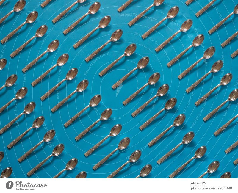 Silver spoons pattern on blue background Breakfast Lunch Dinner Cutlery Spoon Decoration Kitchen Restaurant Tool Art Blue Café cook cooking eat food Horizontal